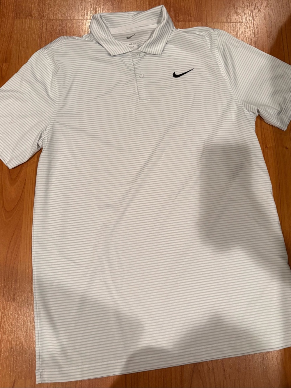 Nike White Polo with Thin Gray Stripes and Black Swoosh